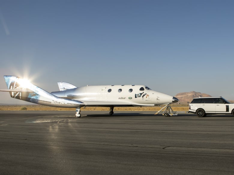 This photo provided by Virgin Galactic shows Virgin Galactic's SpaceShipTwo at the start line of her flight test program with the first taxi test at the Mojave, Calif., airport. 